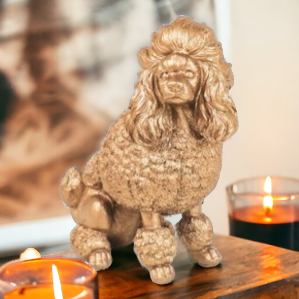 Gouden beeldje van een poedel als aandenken aan overleden hond

