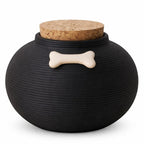 De laatste aai zwarte keramische hondenurn met ribbelpatroon, kurken deksel en decoratief wit botje