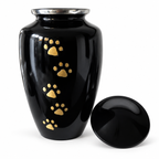 De laatste aai zwarte aluminium urn voor huisdieren met handgelegde gouden pootafdrukken en zilverkleurige rand.