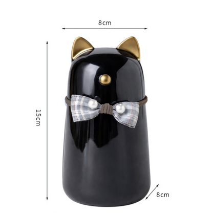 Katten urn 8 x 15 cm  - gemaakt van zwart keramiek, met goudkleurige details en is voorzien van een schattig strikje